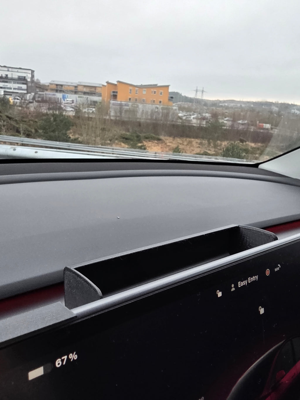 Solbrille holder Tesla