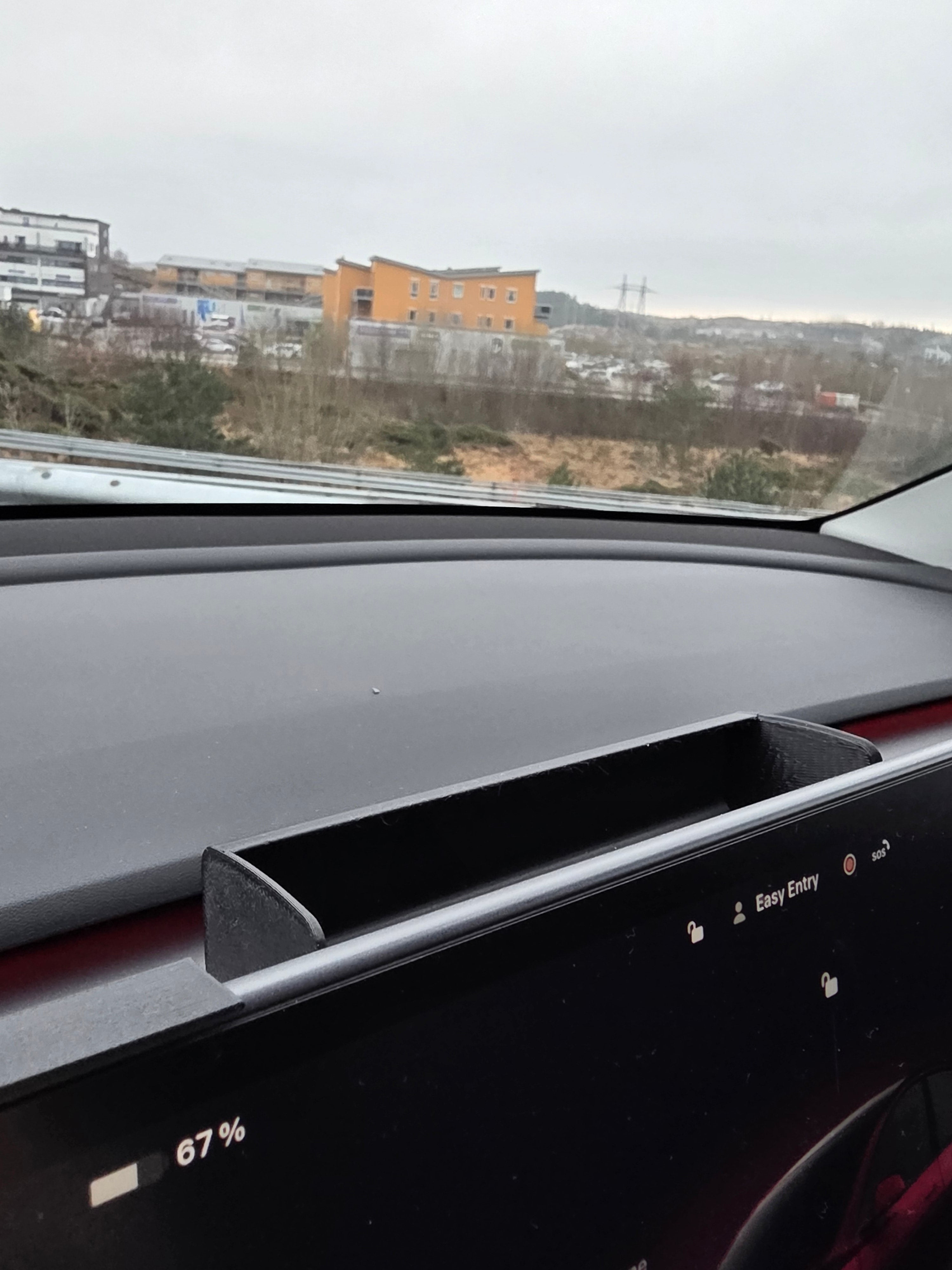 Solbrille holder Tesla